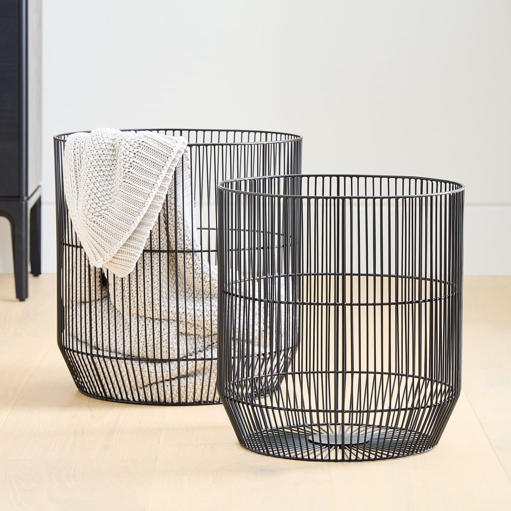 West Elm Fine Line Metal Round Basket ($89-$99)
Just because you live in a more contemporary or modern space doesn't mean you can't embrace those cozy vibes. The West Elm Fine Line Metal Round Basket is the perfect place to store your plush throws when not in use. The clean-lined design is available in black, which goes with nearly everything, and gold for a more glam look.