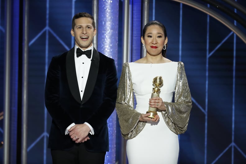 BEVERLY HILLS, CALIFORNIA - JANUARY 06: In this handout photo provided by NBCUniversal,  Hosts Andy Samberg and Sandra Oh speak onstage during the 76th Annual Golden Globe Awards at The Beverly Hilton Hotel on January 06, 2019 in Beverly Hills, California