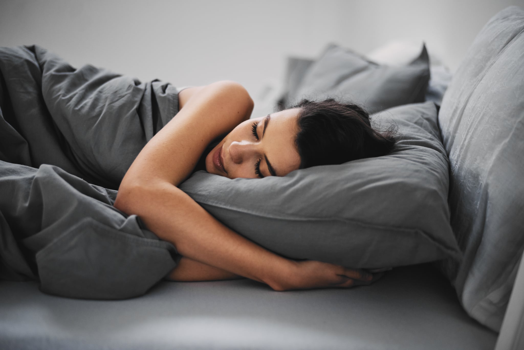 Girl lying down in bed and sleeping