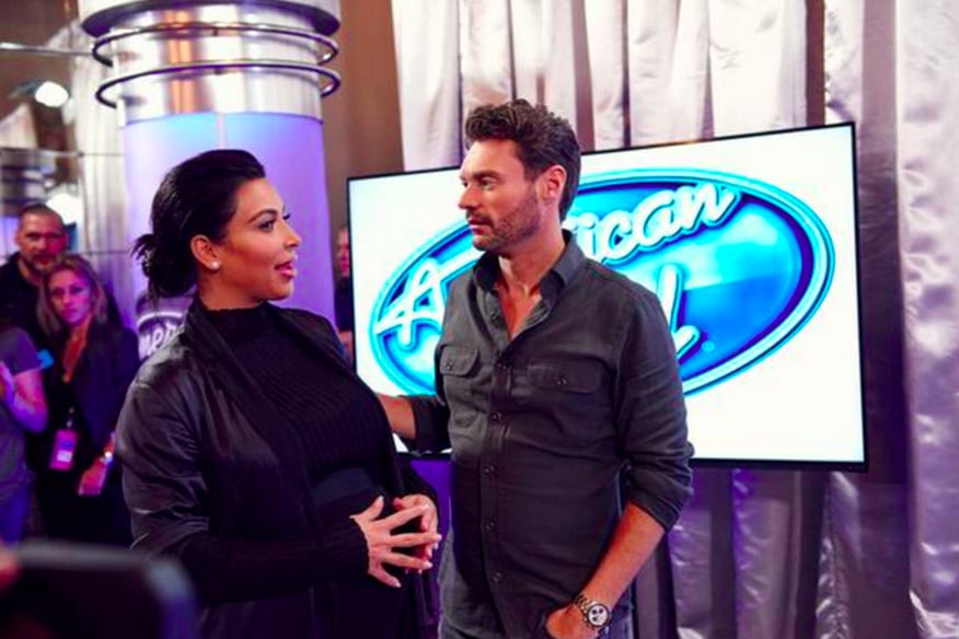 Meanwhile, a pregnant Kim Kardashian mingled outside with Ryan Seacrest.