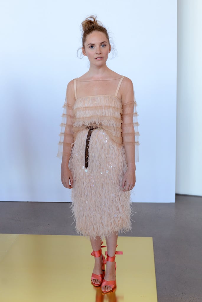 We'd love to see her take things up a notch, upgrading her J.Crew wardrobe to include a feathered dress with a sheer overlay. She might nix the casually looped belt to keep things polished, but she'd turn heads in such a statement piece. 
J.Crew Spring 2017