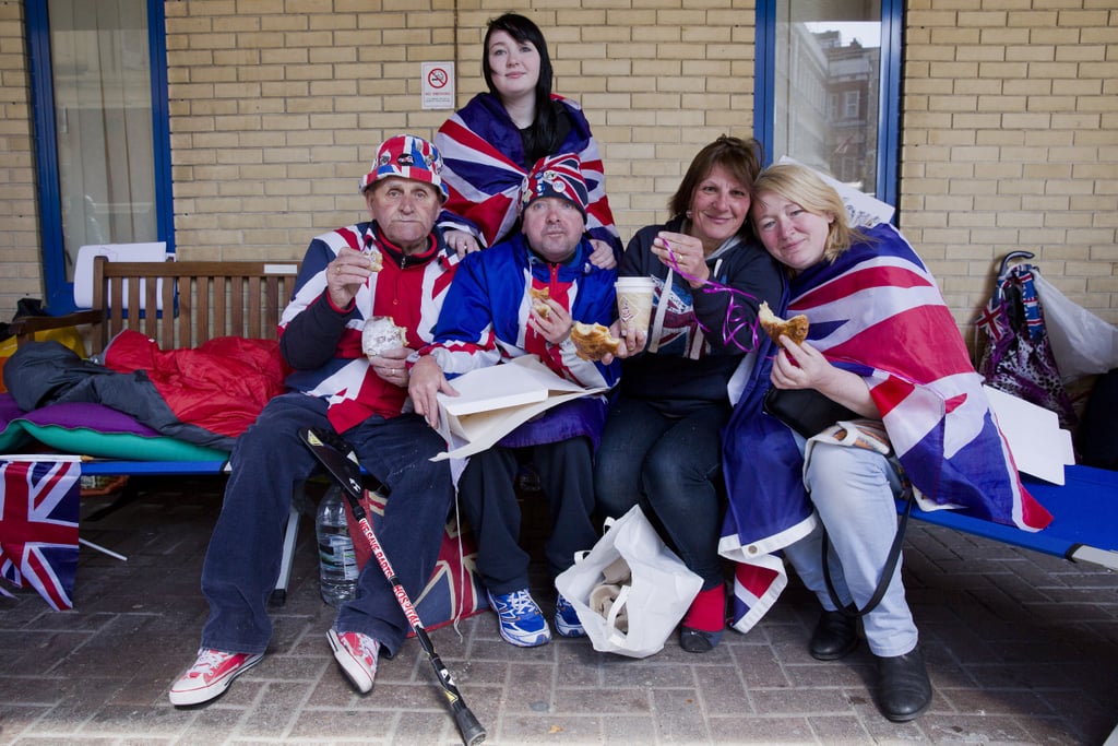 The group posed while eating pastries and drinking coffee sent by Prince William and Kate Middleton.