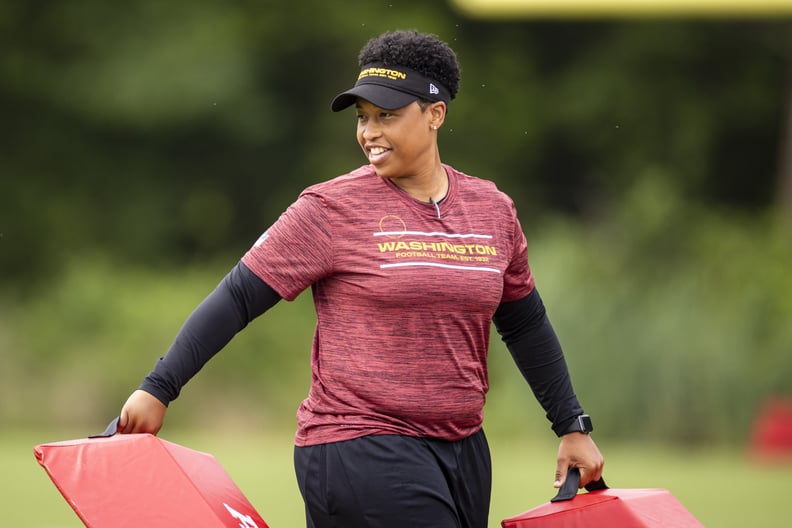 ASHBURN, VA - JUNE 09: Assistant running backs coach Jennifer King moves equipment for a drill during mandatory minicamp at Inova Sports Performance Center on June 9, 2021 in Ashburn, Virginia. (Photo by Scott Taetsch/Getty Images)