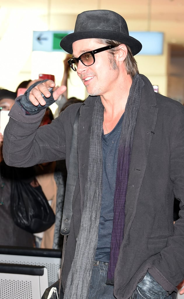 Brad Pitt's fans had him smiling in Tokyo on Friday.
