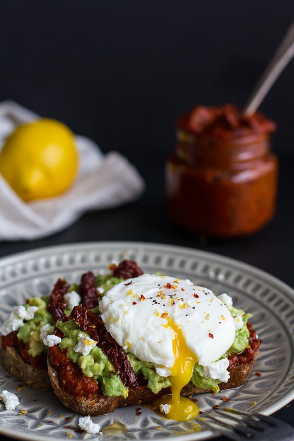 Harissa, Smashed Avocado, and Egg Toast With Goat Cheese and Honey Drizzle