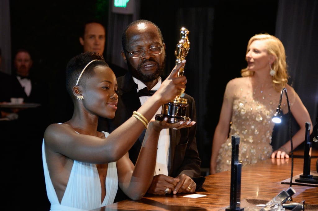 Lupita gave her award a once-over.