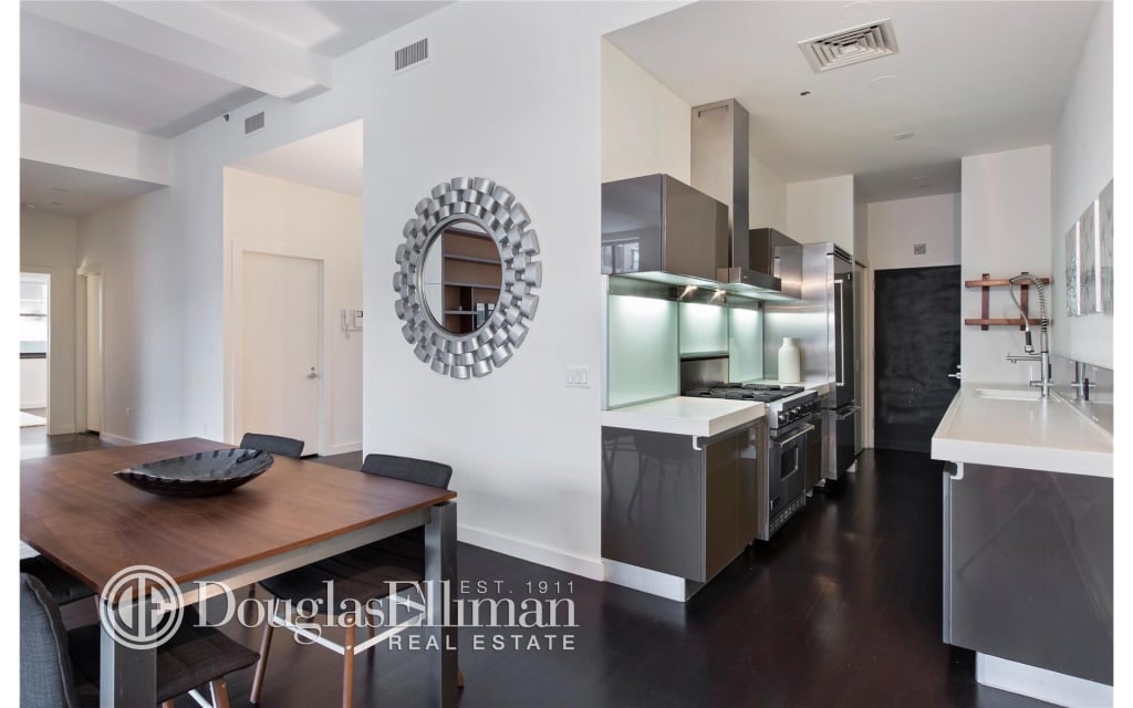 This kitchen is loaded with every modern amenity, from Viking appliances to custom Italian cabinets to a double pantry.
