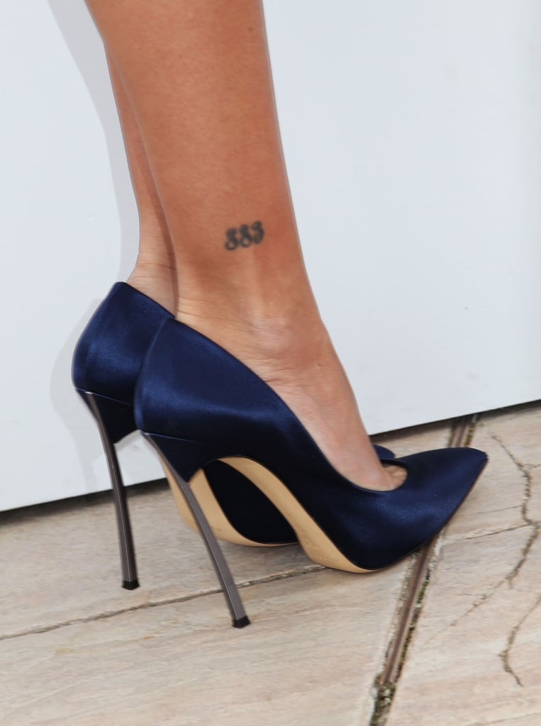 The Spanish actress couldn't be more secretive about the meaning behind her 883 ink.
