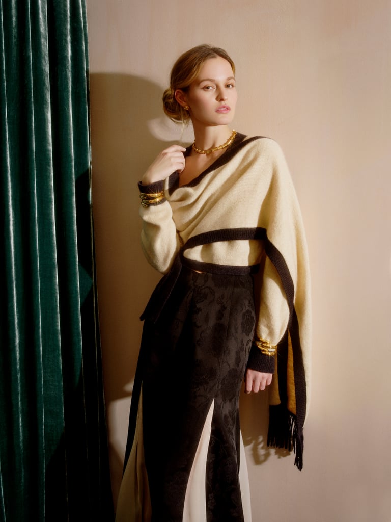 PS: With fashion taking a digital turn the past two seasons, what was your approach to presenting?
AO: It has been challenging showing the collection digitally. It is very different seeing clothing in 2D, rather than seeing the clothing in person. The movement, the drape, the texture and feel do not always translate. I also miss the camaraderie of showing the collections. That being said, I think it is amazing how people have been able to adapt and make it work.
PS: Why is it important for designers to make political statements through their collections?
AO: I think throughout human history art has been a way to make a statement and bring issues to the forefront. Art is an exploration of the human condition, so it is natural for designers to bring that into their work.
PS: Where did the inspiration start for your new collection?
AO: To be honest, it started with me binge watching the TV show Rome, which triggered my love of Classicism again.
PS: Can you pick one look from your new collection that you feel truly speaks to the mood and expression of the range in its entirety?
AO: I love our knitwear this season. It's all sustainable and made in LA. One of my favorite looks from the collection is our shawl sweater worn with a floral jacquard skirt and lots of gold jewelry [above].
