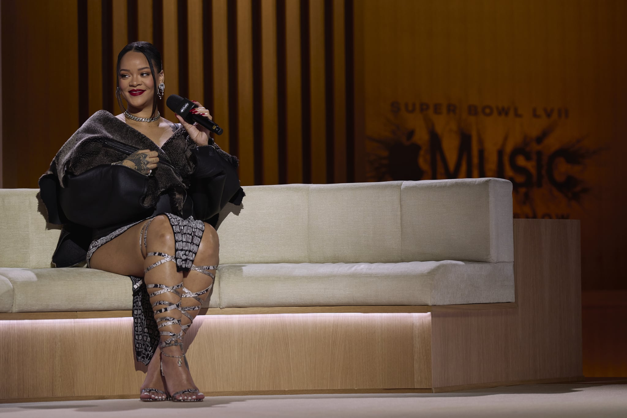 PHOENIX, AZ - FEBRUARY 09: Rihanna speaks during a press conference for the Apple Music Super Bowl 57 halftime show at the Phoenix Convention Center on February 9, 2023 in Phoenix, Arizona. (Photo by Cooper Neill/Getty Images)
