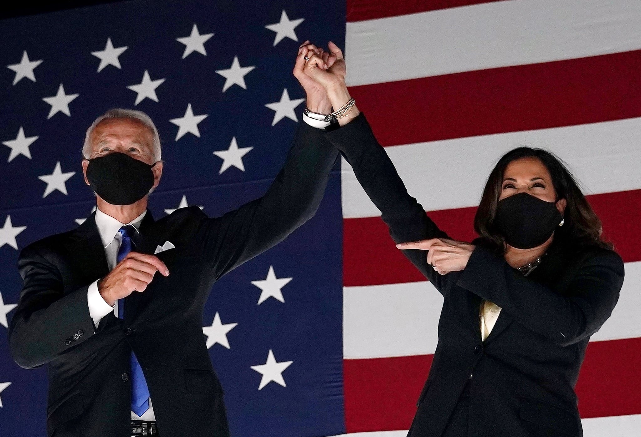 TOPSHOT - Former vice-president and Democratic presidential nominee Joe Biden (L) and Senator from California and Democratic vice presidential nominee Kamala Harris greet supporters outside the Chase Centre in Wilmington, Delaware, at the conclusion of the Democratic National Convention, held virtually amid the novel coronavirus pandemic, on August 20, 2020. (Photo by Olivier DOULIERY / AFP) (Photo by OLIVIER DOULIERY/AFP via Getty Images)