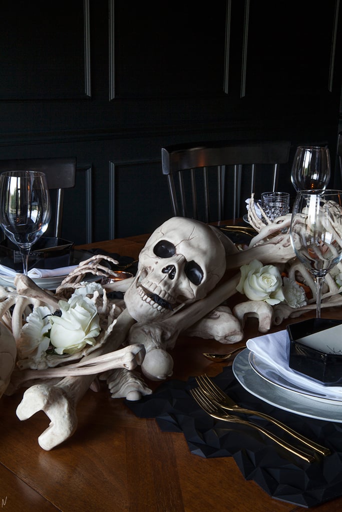 Working in layers, she strategically arranged the bones across the table.