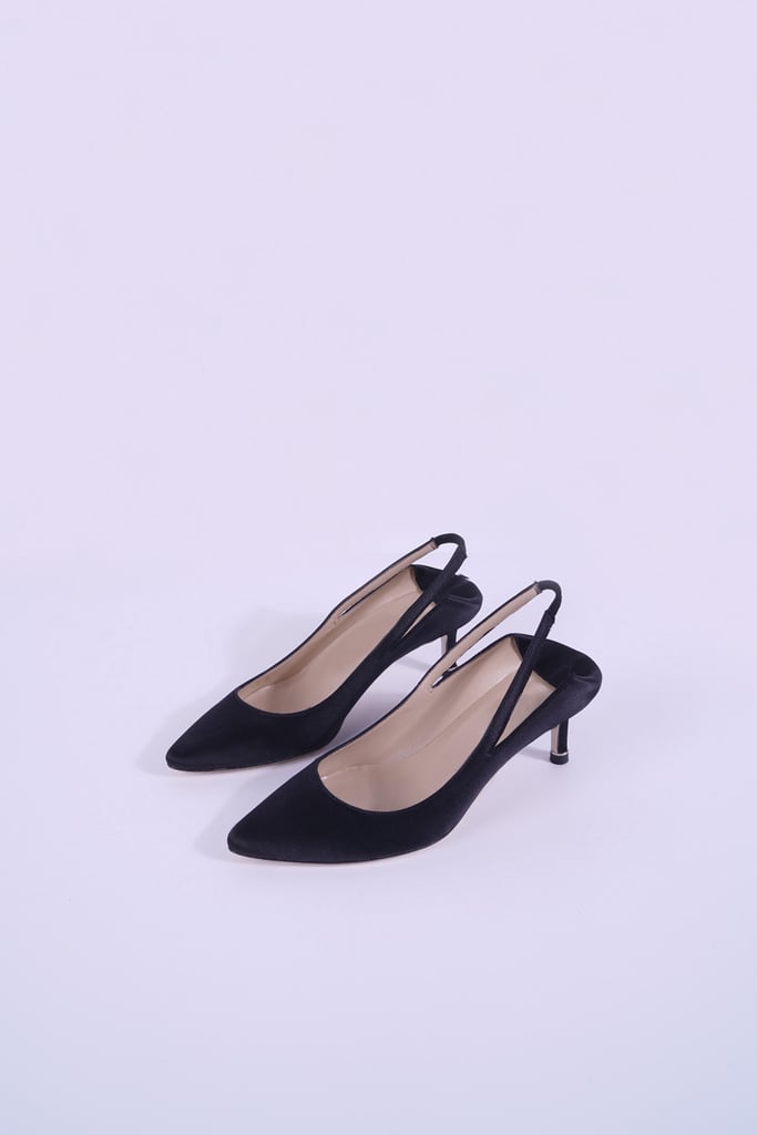 "I've been on the hunt for a dainty black pumps and nothing really seemed to catch my eye until I saw these beauties. These Genuine People Satin Slingback Pumps ($199) are as dainty as you can get." — NR