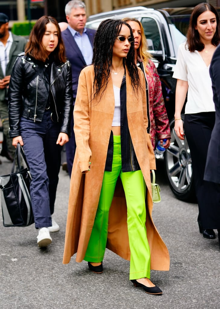 Yes, slime green can look this cool. Zoë styled her slacks with a men's striped shirt worn undone and oversize over a lace camisole, and a long suede duster. She accessorised with a covetable croc-effect By Far bag in sage.