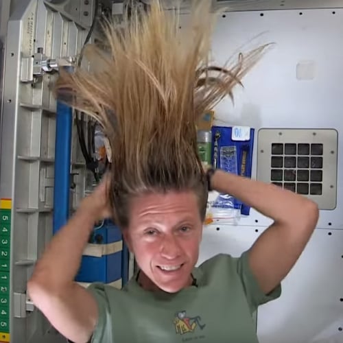 astronaut washing hair in space