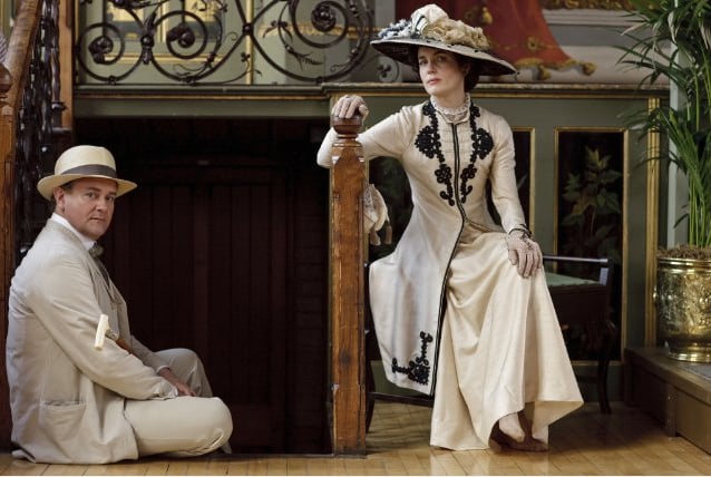 As compared to Victorian styles, Edwardian fashion was looser and less restrictive. That's not to say that clothing was comfortable, though. Cora and her daughters would definitely have worn corsets beneath their clothing, which explains why they needed help dressing.
Source: ITV