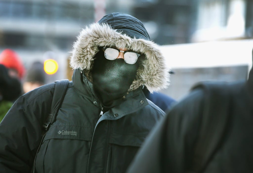 A man's glasses looked nearly frozen as he made the morning commute.