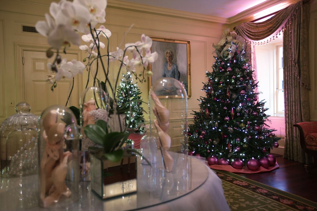 In the Vermeil Room, the holiday decor gets a feminine spin with lovely orchids, pearlescent touches, and even pink accents.