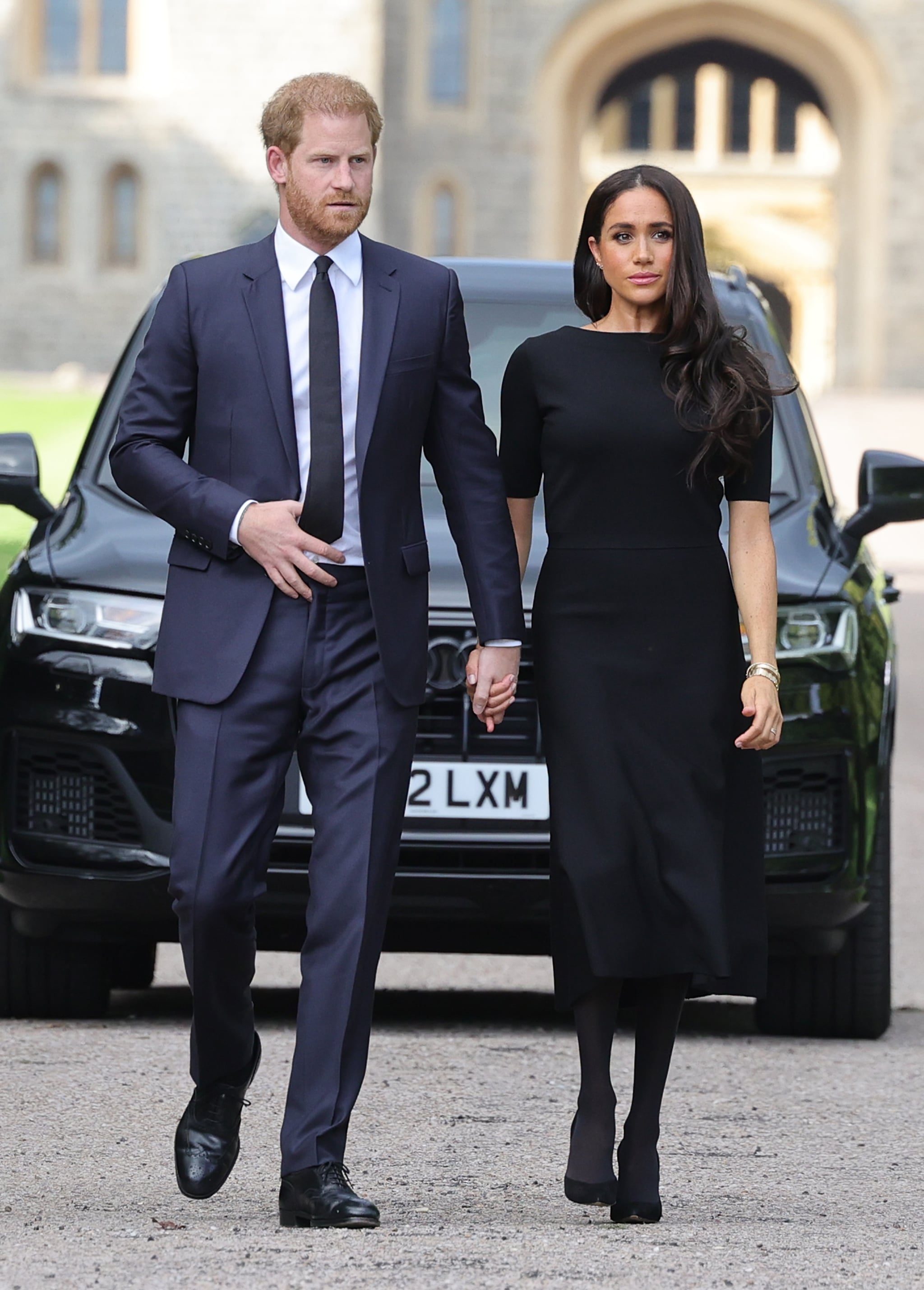 WINDSOR, ENGLAND - SEPTEMBER 10: Prince Harry, Duke of Sussex, and Meghan, Duchess of Sussex arrive on the long Walk at Windsor Castle arrive to view flowers and tributes to HM Queen Elizabeth on September 10, 2022 in Windsor, England. Crowds have gathered and tributes left at the gates of Windsor Castle to Queen Elizabeth II, who died at Balmoral Castle on 8 September, 2022. (Photo by Chris Jackson/Getty Images)