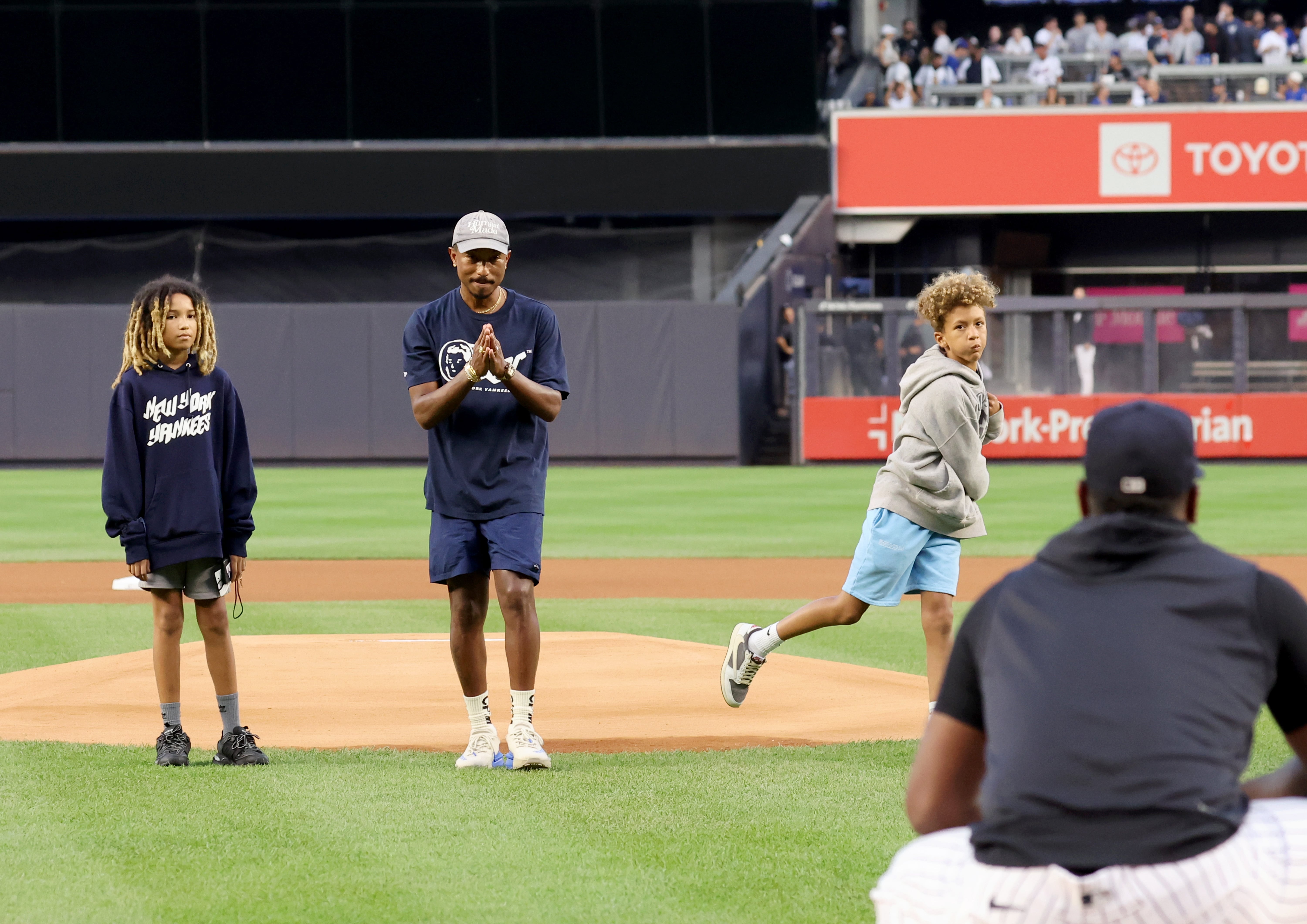 Pharrell and Son Throw First Pitch at New York Yankees Game