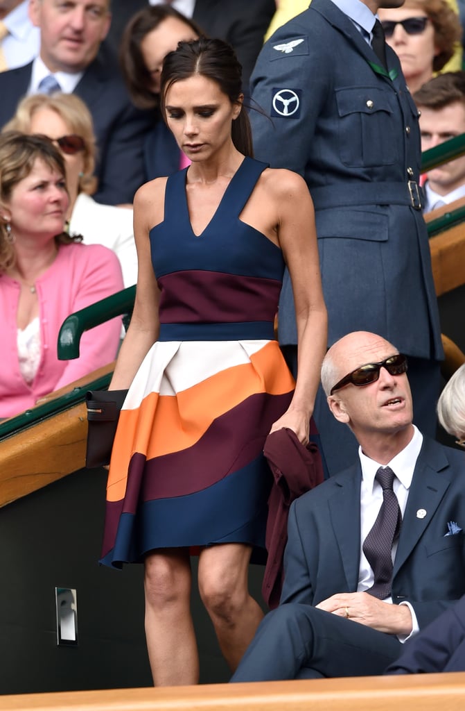 Wearing a colorblock sundress from her own collection at Wimbledon in July 2014.