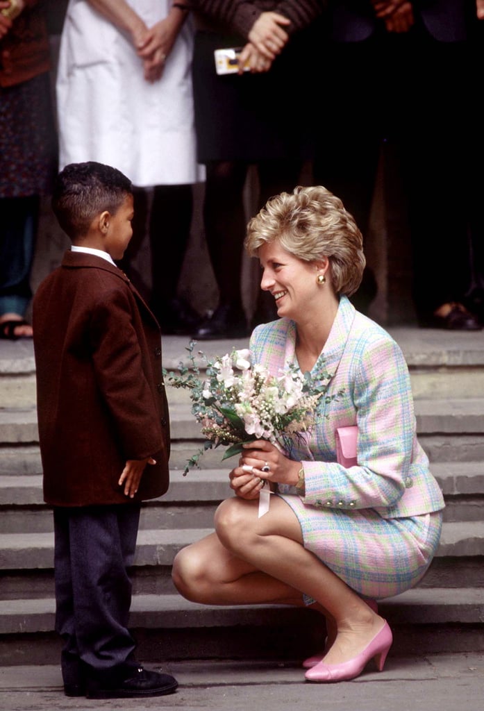 In May 1993, Diana got down on a little boy's level to accept a bouquet of flowers outside Great Ormond Street Hospital in London.