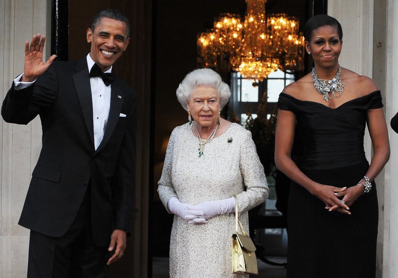 US President Barack Obama (L) and First Lady Michelle Obama (R) greet Britain's Queen Elizabeth II before a reciprocal dinner at the Winfield House in London, on May 25, 2011. Obama and his wife Michelle enjoyed a regal welcome from Queen Elizabeth II, wh