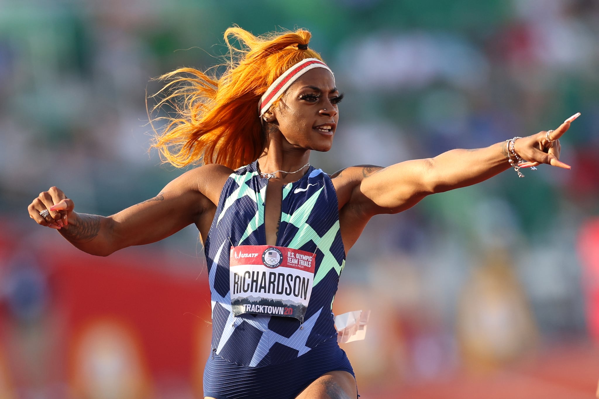 EUGENE, OREGON - JUNE 19: Sha'Carri Richardson runs and celebrates in the Women's 100 Meter semifinal on day 2 of the 2020 U.S. Olympic Track & Field Team Trials at Hayward Field on June 19, 2021 in Eugene, Oregon. (Photo by Patrick Smith/Getty Images)