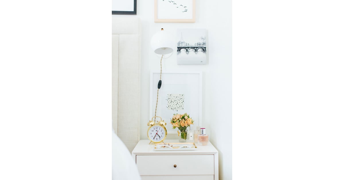 By using a mounted wall light above her nightstand, Alaina freed up