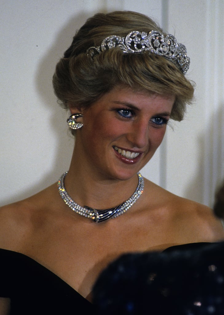 Diana wore the Spencer family tiara and crescent-shaped diamond and sapphire earrings, necklace, and bracelet given to her by the Sultan of Oman during a banquet in Germany in November 1987.