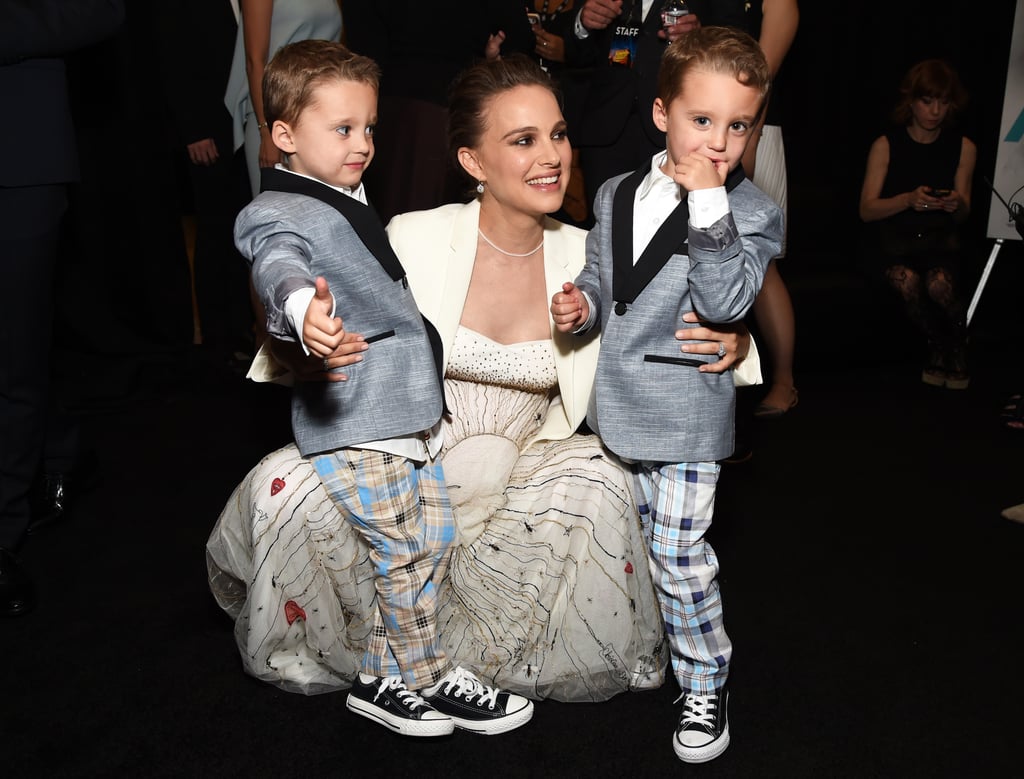 The dress was so flowy, she was even able to bend down to hug her two little costars Aiden and Brody Weinberg.