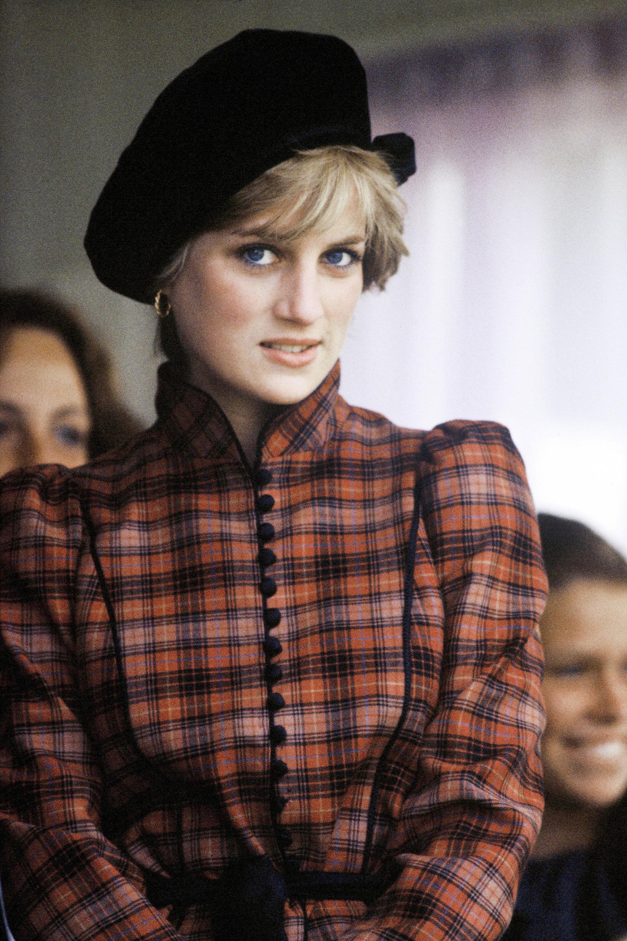 Princess Diana looked strikingly sweet with a cute chapeau and sweeping bangs.