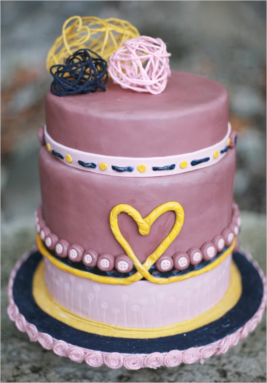 It's all about the sweet details when it comes to this purple, memorable cake, from the heart to the buttons and everything in between. 
Photo by Diana Marie Photography via Wedding Chicks