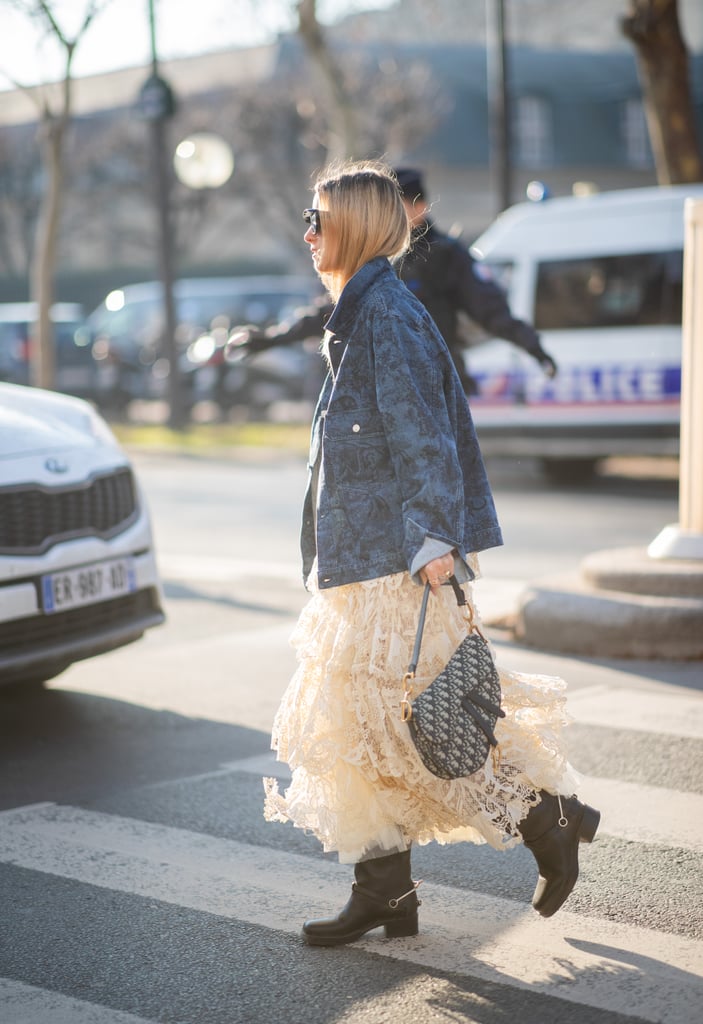 Toughen up a ruffled lace dress with a denim jacket and hefty boots. Bonus points if you have an iconic Dior saddle bag to finish.