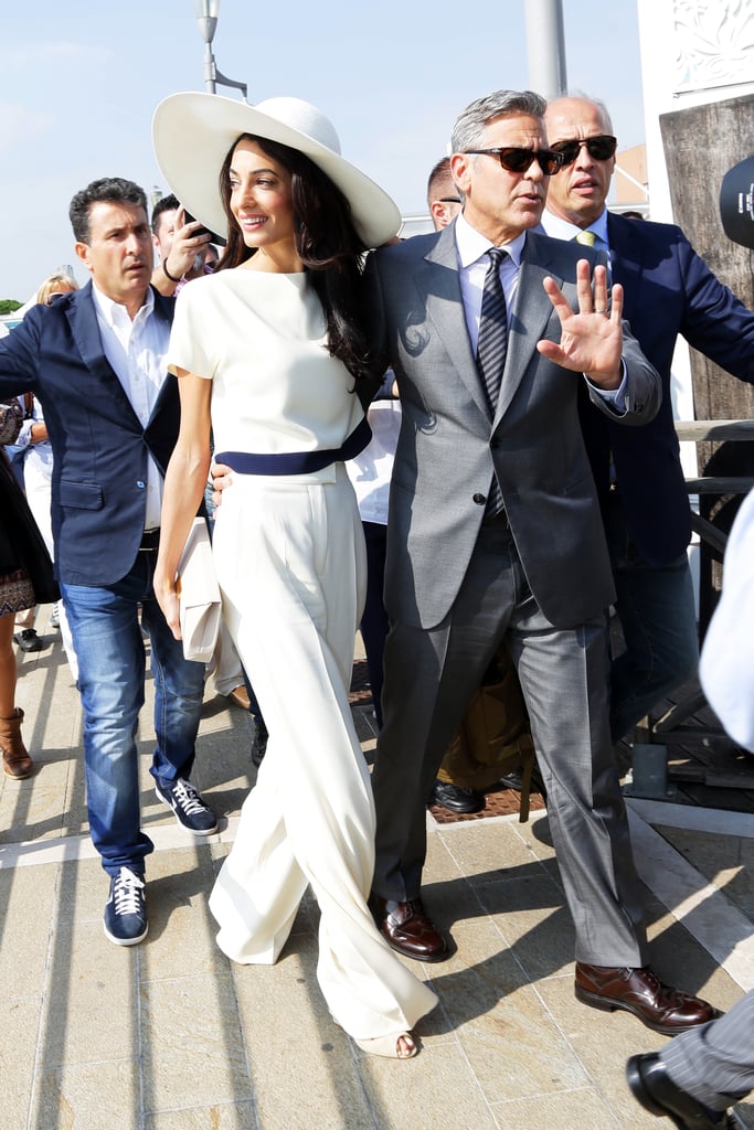 This Stella McCartney jumpsuit is one of our favourite looks on Amal. The navy ribbon at the waist and around her ultraglam wide-brim hat is transporting us to the French Riviera.