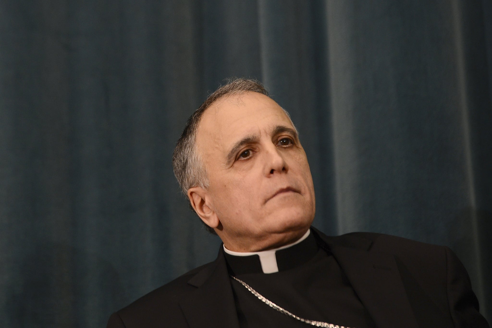 US cardinal Daniel DiNardo listens during a press conference at the North American College on March 5, 2013 in Rome. The Vatican said Tuesday that the date for the conclave to elect a new pope could be set before all cardinals have arrived in Rome, as five electors were still missing from the roll call.  AFP PHOTO / ANDREAS SOLARO        (Photo credit should read ANDREAS SOLARO,ANDREAS SOLARO/AFP/Getty Images)