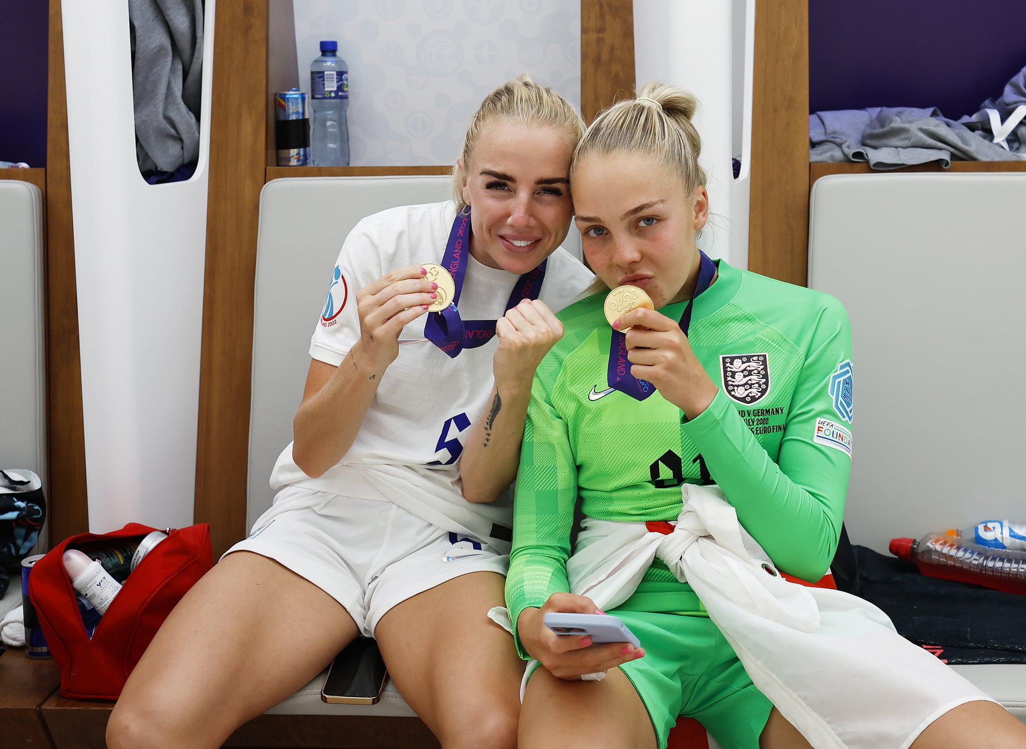 LONDON, ENGLAND - JULY 31: Alex Greenwood and Ellie Roebuck of England celebrate with their winners medals following victory in the UEFA Women's Euro 2022 final match between England and Germany at Wembley Stadium on July 31, 2022 in London, England. (Photo by Lynne Cameron - The FA/The FA via Getty Images)