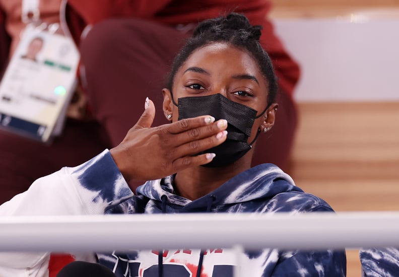 TOKYO, JAPAN - JULY 28: Simone Biles of Team United States blows a kiss whilst watching the Men's All-Around Final on day five of the Tokyo 2020 Olympic Games at Ariake Gymnastics Centre on July 28, 2021 in Tokyo, Japan. (Photo by Jamie Squire/Getty Image