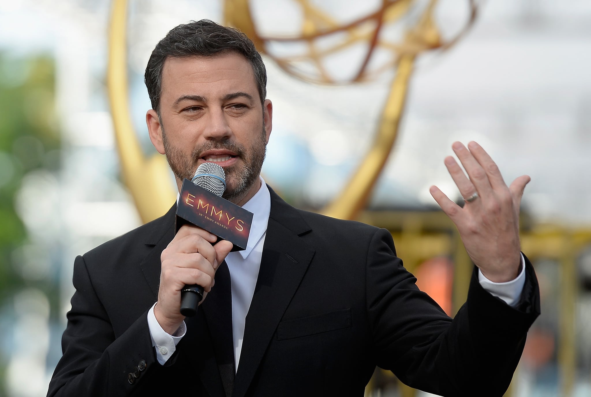 LOS ANGELES, CA - SEPTEMBER 14:  (EDITORS NOTE: Alternative crop of image 605663874) Host Jimmy Kimmel speaks during the red carpet  rollout for the 68th Emmy Awards press preview day at Microsoft Theatre on September 14, 2016 in Los Angeles, California.  (Photo by Kevork Djansezian/Getty Images)