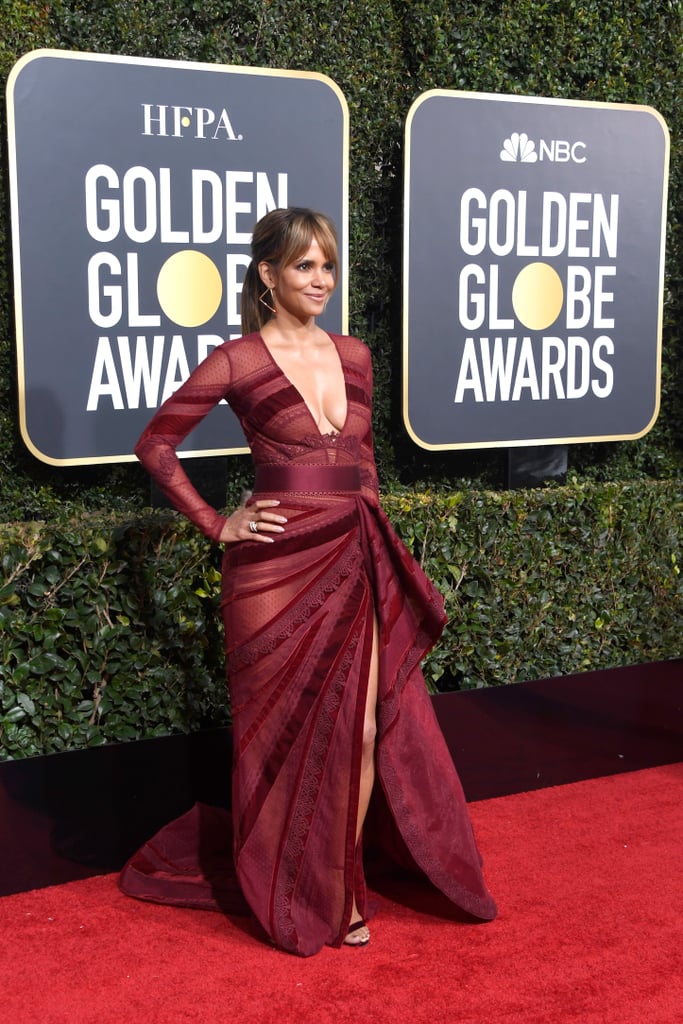 Halle Berry wearing a Zuhair Murad gown with multiple sheer panels and Loriblu shoes.