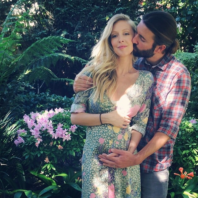 The photogenic couple announced her pregnancy with this moment in mid-March. "Well, it's time we share the good news," she wrote. "We're having a baby."