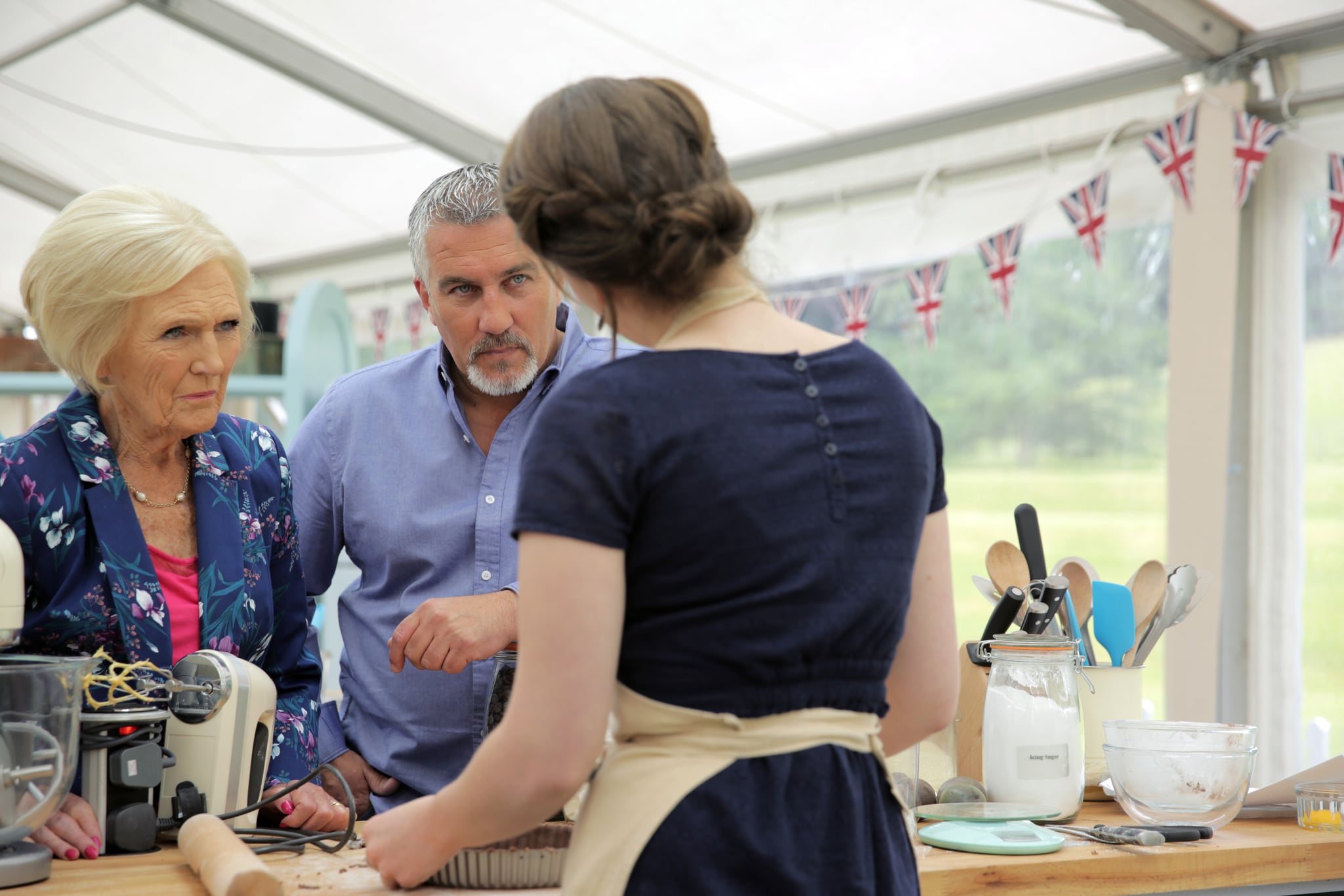 THE GREAT BRITISH BAKE OFF (aka THE GREAT BRITISH BAKING SHOW), from left: judges Mary Berry, Paul Hollywood, Flora Shedden (back to camera), 'Episode 9: Chocolate', (Series 6, ep. 609, originally aired in U.K. on Sept. 30, 2015). photo: PBS/Love Productions / Courtesy: Everett Collection