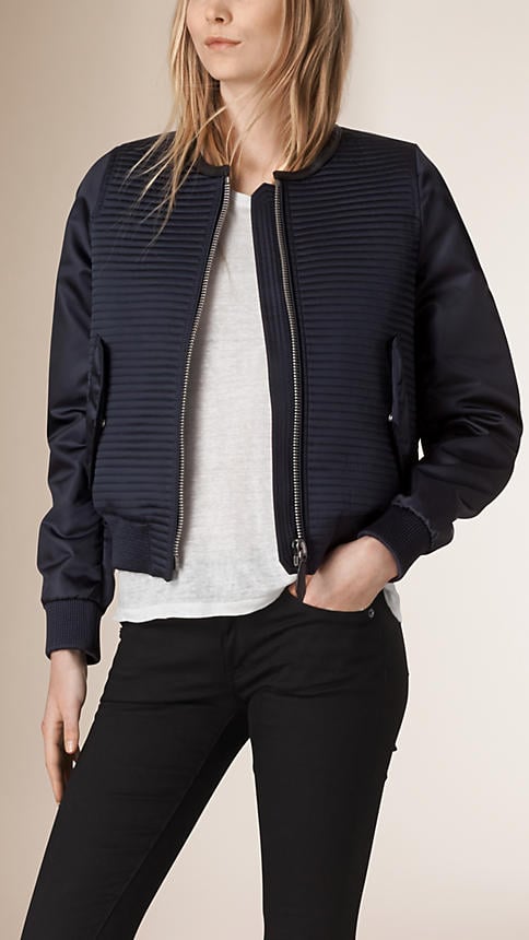 "It's not just the lightweight layering options that come with bomber jackets that I love so much; it's their sporty appeal. I've always been a midnight-navy girl, so this quilted Burberry number (1,195), finished with leather piping, really spoke to me." — SW