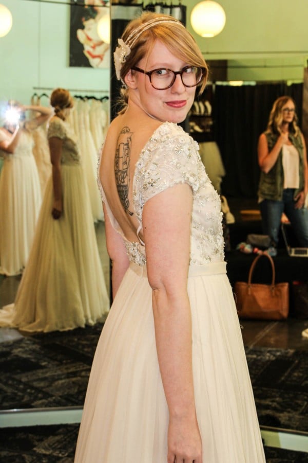 Junebug: What styles fit best with different body types?
Unbridaled:

Hourglass — A dress that accentuates your curves, such as a mermaid
Pear Shaped — A classic A-line silhouette with a skirt that flares out at the waist
Tall — Long, elegant, and simple silhouettes
Busty — Sweetheart necklines
Petite — Sheath and Trumpet styles
Plus-Sized — Empire

***Junebug Tip: Wedding dresses fit differently than regular clothing and it’s difficult to tell what style will work best with your figure before you start trying on dresses, so we advise that you go into your first dress boutique with an open mind, because you might be surprised!