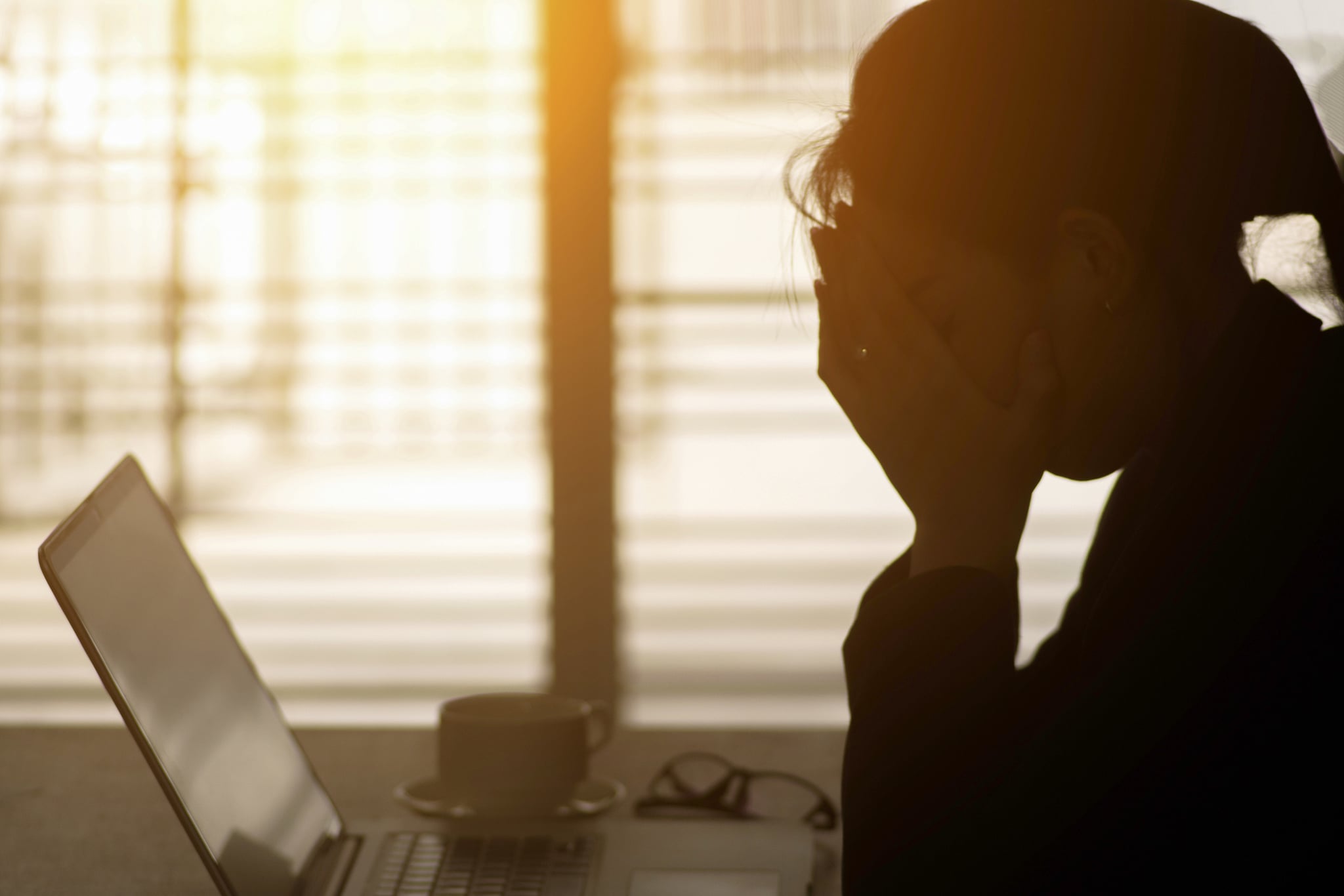 Businesswoman using computer in the office. Stress in the office