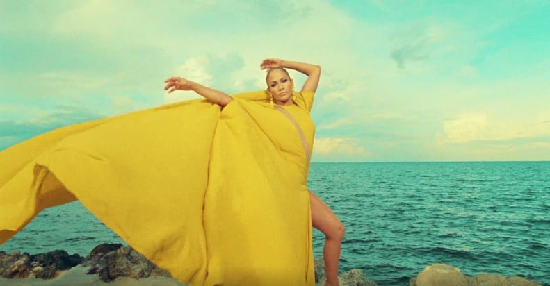 She Wore a Jaw-Dropping Bright Yellow Cape Dress With an S-Shaped Sheer Panel