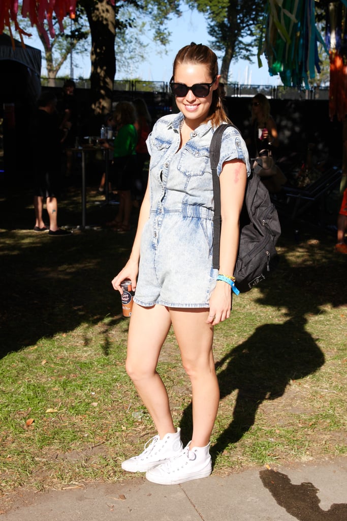 Proof that sneakers look good with everything: an acid-washed MinkPink denim romper and Tom Ford sunglasses were all this woman needed to look the part of a street style star.