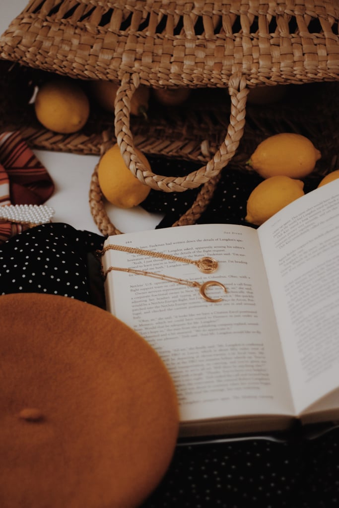 Wear book-themed jewelry.