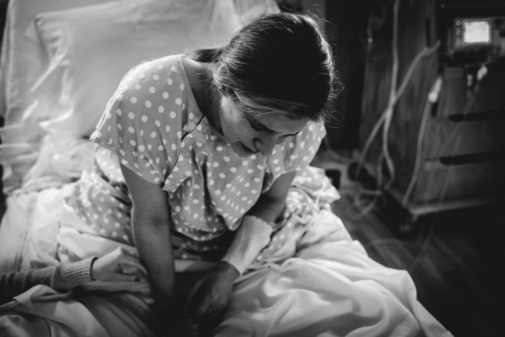 Tearful Rainbow Baby Birth Photo
