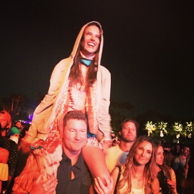 Alessandra Ambrosio watched the music from a friend's shoulders.
Source: Instagram user alessandraambrosio